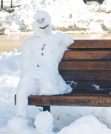 Snowman on a bench